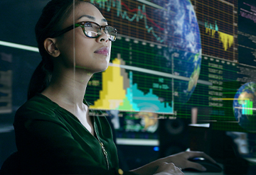 Woman examines economic data in futuristic office