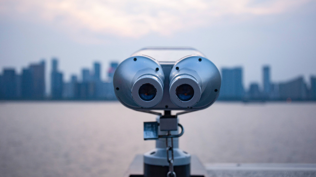 Binoculars looking across a city