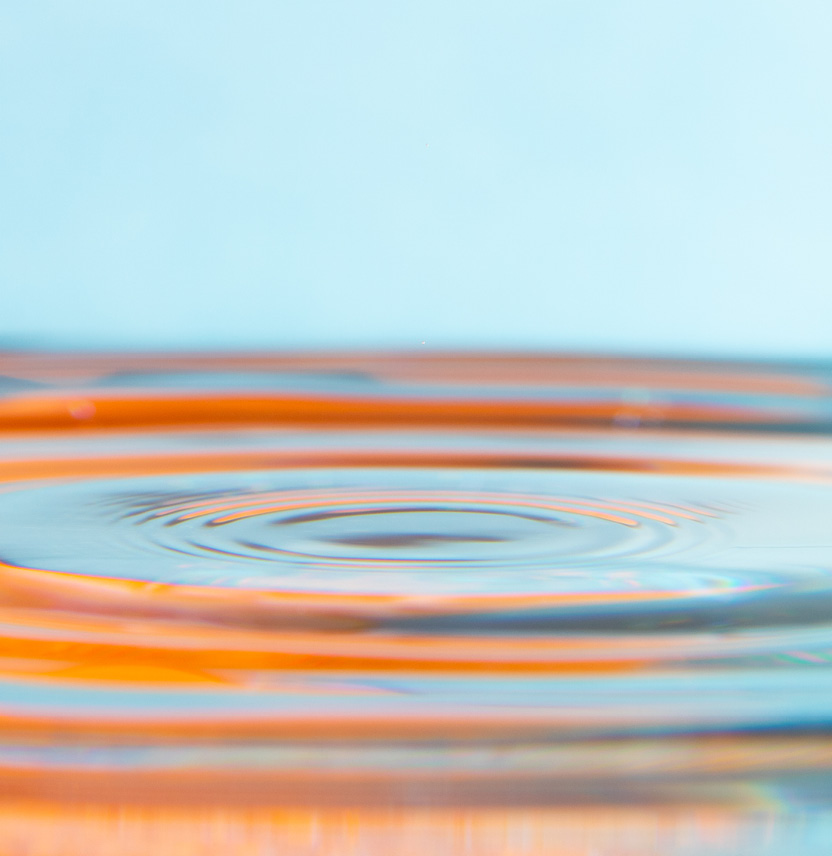 Image of a series of ripples expanding in liquid