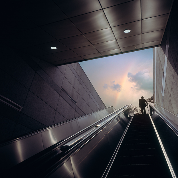 Image of a person travelling up an elevator